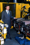 77 Dhr.B.A.Th.F. Assink algemeen directeur firma Auping.(1987-1996) bij de eerste lasrobot voor de komfortabel ...